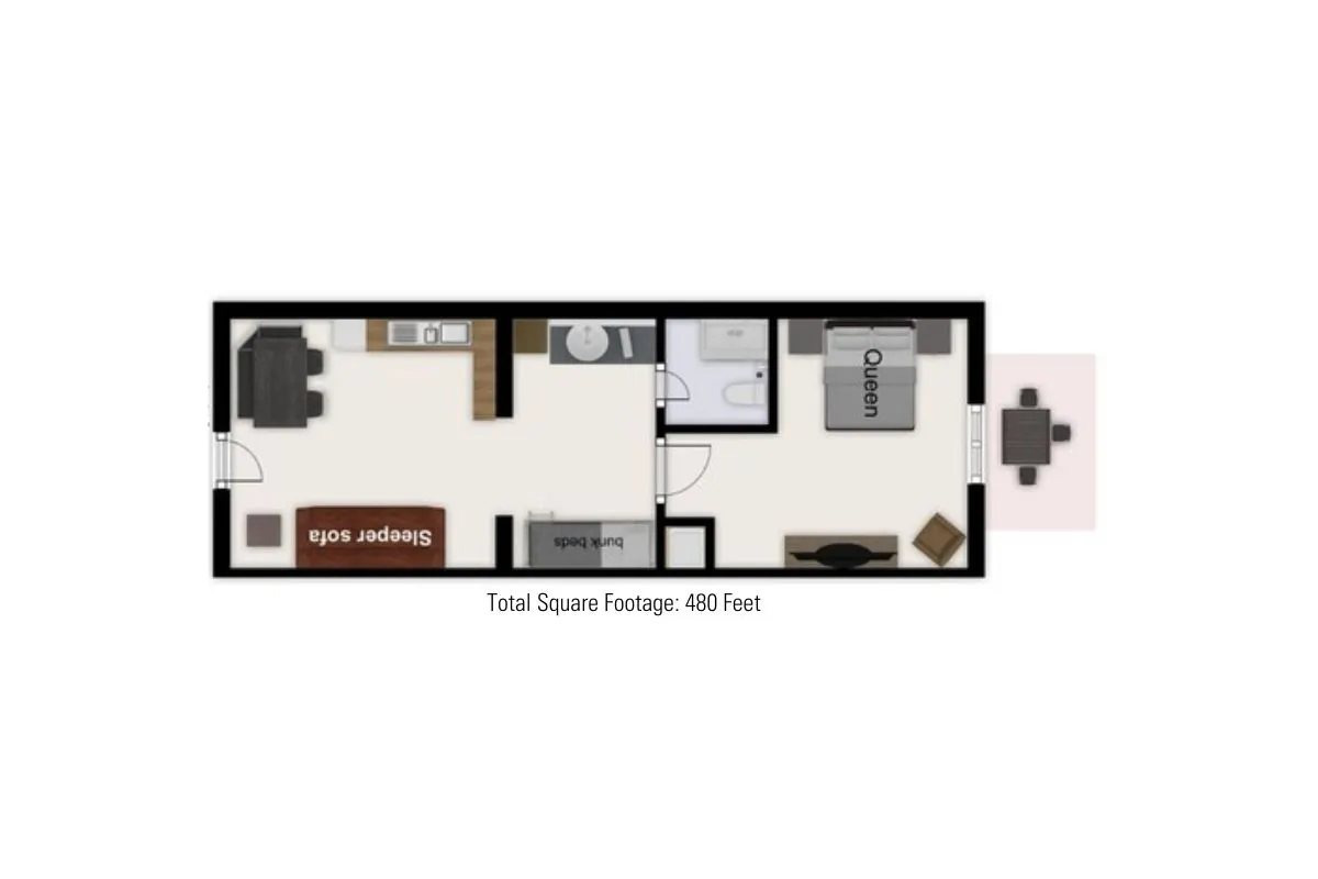 This interior scene spotlights a queen bed, a sleeper sofa, and a dining table—all in one inviting, multifunctional area. The focus is on comfort and flexibility for relaxing, dining, or sleeping.